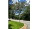 Street view shows a black and white One Way street sign surrounded by green trees and blue sky at 2880 Elizabeth Se St, Smyrna, GA 30080