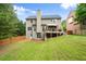 Spacious, grassy backyard featuring a deck, perfect for outdoor entertaining and relaxation at 3070 Jardin Nw Ln, Kennesaw, GA 30152
