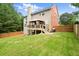 Expansive backyard with a deck and lush green lawn, perfect for outdoor gatherings at 3070 Jardin Nw Ln, Kennesaw, GA 30152