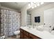 Well-lit bathroom featuring a shower with patterned curtains at 3070 Jardin Nw Ln, Kennesaw, GA 30152