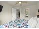 Bedroom featuring a colorful bedspread and an entry to an adjacent room at 3070 Jardin Nw Ln, Kennesaw, GA 30152