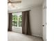 Cozy bedroom with large window and neutral decor at 3070 Jardin Nw Ln, Kennesaw, GA 30152