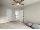 Bright bedroom with a ceiling fan and access to other rooms at 3070 Jardin Nw Ln, Kennesaw, GA 30152