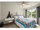 Bedroom featuring a colorful bedspread and a well-lit desk area at 3070 Jardin Nw Ln, Kennesaw, GA 30152