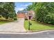 Charming two-story brick home features a well-manicured lawn and an attached two-car garage at 3070 Jardin Nw Ln, Kennesaw, GA 30152