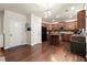 Spacious kitchen features hardwood floors, center island, dark appliances, and ample counter space, perfect for cooking at 3070 Jardin Nw Ln, Kennesaw, GA 30152