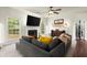 Cozy living room with a fireplace, neutral colors, and a comfortable gray sofa for relaxation and entertainment at 3070 Jardin Nw Ln, Kennesaw, GA 30152