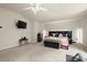 Large main bedroom features a ceiling fan, wall-mounted TV, lots of natural light, and plush carpeting at 3070 Jardin Nw Ln, Kennesaw, GA 30152