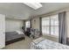 Shared bedroom with two beds and a closet, featuring natural light from two windows at 1545 Smoke Hill Dr, Hoschton, GA 30548