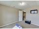 Bedroom with neutral walls and carpet with a TV mounted to the wall at 1545 Smoke Hill Dr, Hoschton, GA 30548