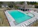 Community pool with ample lounge chairs, covered seating area, and a mushroom-shaped water feature for children at 1545 Smoke Hill Dr, Hoschton, GA 30548