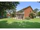 Lush backyard featuring a pergola-covered patio, playset, and well-manicured lawn at 2023 Belridge Se Ct, Smyrna, GA 30080