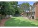 Spacious backyard featuring a playset, trampoline, pergola, and patio perfect for outdoor activities at 2023 Belridge Se Ct, Smyrna, GA 30080