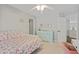 Bright bedroom boasts plush carpet, neutral decor, and ensuite bathroom access at 2023 Belridge Se Ct, Smyrna, GA 30080