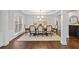 Elegant dining room with classic furnishings, decorative rug, and stylish chandelier at 2023 Belridge Se Ct, Smyrna, GA 30080