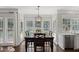 Bright dining area with dark table, backyard views, and open to kitchen with stainless appliances at 2023 Belridge Se Ct, Smyrna, GA 30080