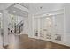 Inviting foyer with hardwood flooring, French doors to playroom, and staircase at 2023 Belridge Se Ct, Smyrna, GA 30080