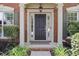 Close-up of the front door with sidelights, trimmed with classic molding at 2023 Belridge Se Ct, Smyrna, GA 30080