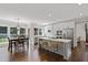 Eat-in kitchen features stainless appliances, white cabinets, a center island, and breakfast bar at 2023 Belridge Se Ct, Smyrna, GA 30080
