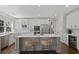 Modern kitchen boasting stainless appliances, center island, and bar stool seating at 2023 Belridge Se Ct, Smyrna, GA 30080