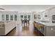 Open concept kitchen and dining area with large windows, stainless appliances, and counter seating at 2023 Belridge Se Ct, Smyrna, GA 30080