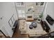 Open-concept living room with fireplace, high ceilings, and stylish furnishings, perfect for relaxation at 2023 Belridge Se Ct, Smyrna, GA 30080