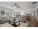 Open floor plan with living room, dining area, and modern kitchen offering backyard views at 2023 Belridge Se Ct, Smyrna, GA 30080