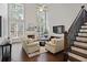 Bright living room with soaring ceilings, fireplace, and large windows at 2023 Belridge Se Ct, Smyrna, GA 30080