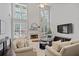 Elegant living room featuring high ceilings, a fireplace, and ample natural light at 2023 Belridge Se Ct, Smyrna, GA 30080