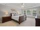 Serene bedroom with tray ceiling, decorative accents, and natural light for restful retreat at 2023 Belridge Se Ct, Smyrna, GA 30080