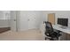 Office with a modern white desk, black chair and a view of the open doorway at 2023 Belridge Se Ct, Smyrna, GA 30080