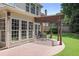 Outdoor patio under a pergola with dining furniture and a view of the well-maintained yard at 2023 Belridge Se Ct, Smyrna, GA 30080