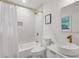 Bright bathroom features a vessel sink, subway-tiled shower, and gold fixtures at 2244 Alpha Dr, Decatur, GA 30032
