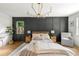 This bedroom is painted with neutral colors and features a striking dark gray paneled accent wall at 2244 Alpha Dr, Decatur, GA 30032
