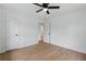 An empty bedroom with hardwood floors, white walls, and a ceiling fan awaits personal touches at 2244 Alpha Dr, Decatur, GA 30032