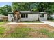 Charming renovated home featuring new paint, a gabled entry, and a well-manicured front yard at 2244 Alpha Dr, Decatur, GA 30032