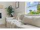 Close up of sofa with decorative pillows and blanket at 2244 Alpha Dr, Decatur, GA 30032