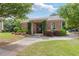 Well-maintained brick community clubhouse with landscaping and paved walkway at 2307 Loughridge Dr, Buford, GA 30519