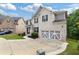 Charming two-story home with a brick facade, manicured lawn, and a two-car garage at 2307 Loughridge Dr, Buford, GA 30519
