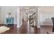 Inviting foyer with hardwood floors, a staircase, and wainscoting for an elegant entry at 2307 Loughridge Dr, Buford, GA 30519