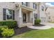Charming two-story home with a brick facade, manicured lawn, and a two-car garage at 2307 Loughridge Dr, Buford, GA 30519