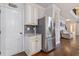 Well-lit kitchen with stainless steel refrigerator and ample cabinet space at 2307 Loughridge Dr, Buford, GA 30519