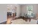 Bright living room with hardwood floors, complemented by elegant archways and a cozy rug at 2307 Loughridge Dr, Buford, GA 30519