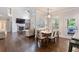 Bright, open floorplan features hardwood floors, a fireplace, and an eat-in kitchen with stainless appliances at 2307 Loughridge Dr, Buford, GA 30519