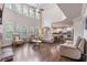 Spacious living room with high ceilings, many windows, hardwood floors, and an open floor plan at 2307 Loughridge Dr, Buford, GA 30519