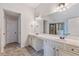 Elegant main bathroom featuring double vanity sinks, granite countertop, and glass-enclosed shower at 2307 Loughridge Dr, Buford, GA 30519
