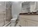 Bathroom featuring neutral-toned walls, a glass enclosed shower, and vanity at 2910 Creek Tree Ln, Cumming, GA 30041