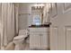 Bathroom featuring neutral-toned walls, a glass enclosed shower, and vanity at 2910 Creek Tree Ln, Cumming, GA 30041