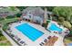 Aerial view of a community pool and lounge area, featuring a lap pool and a free form pool at 2910 Creek Tree Ln, Cumming, GA 30041