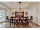 Formal dining room featuring hardwood floors, a large dining table, and elegant decor at 2910 Creek Tree Ln, Cumming, GA 30041